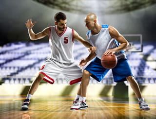 Two basketball players in game